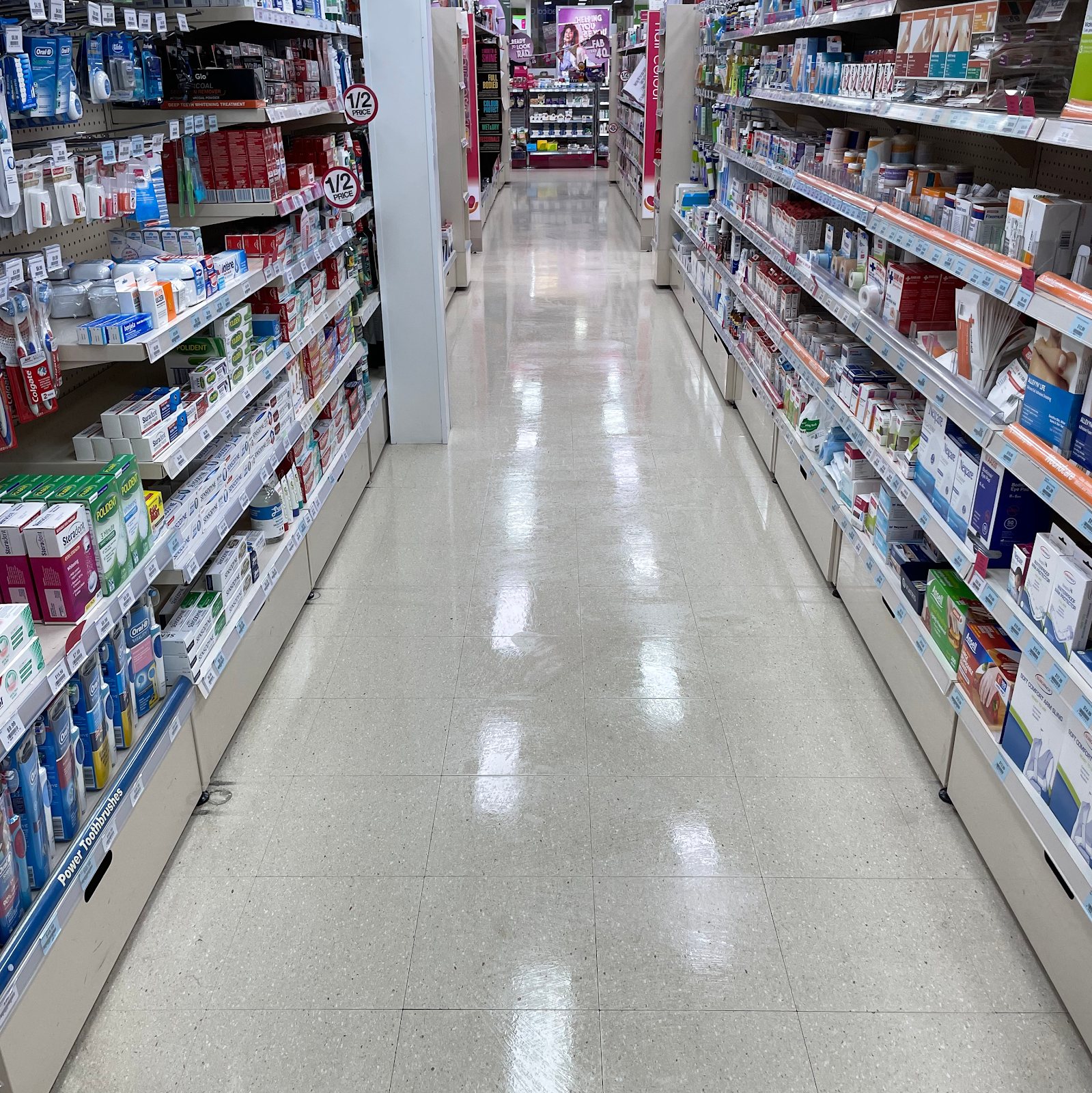 Freshly polished pharmacy aisle floor